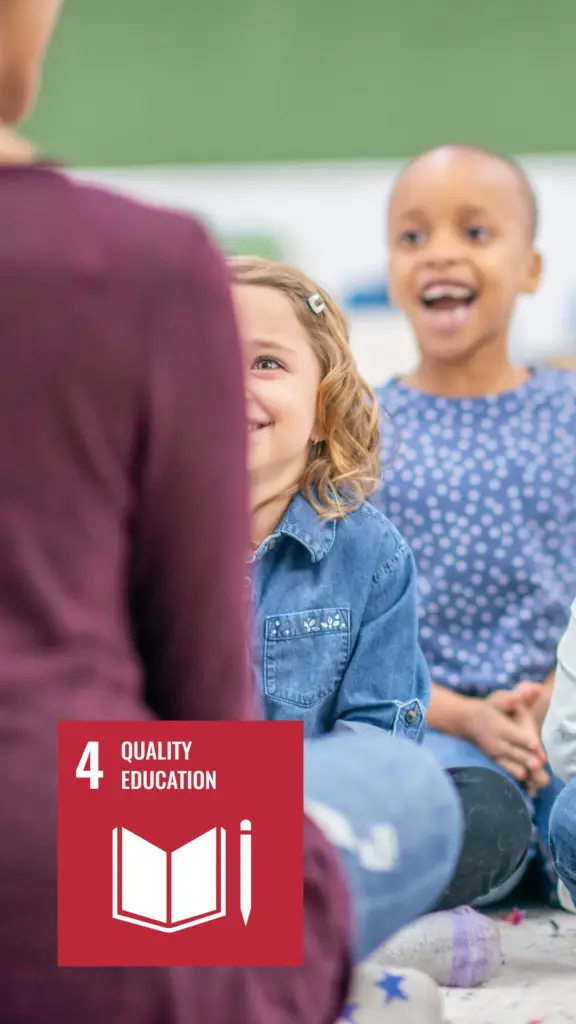 Children engaged in an informal learning activity in a classroom, with a logo in the corner promoting Quality Education, the fourth Sustainable Development Goal by the United Nations.